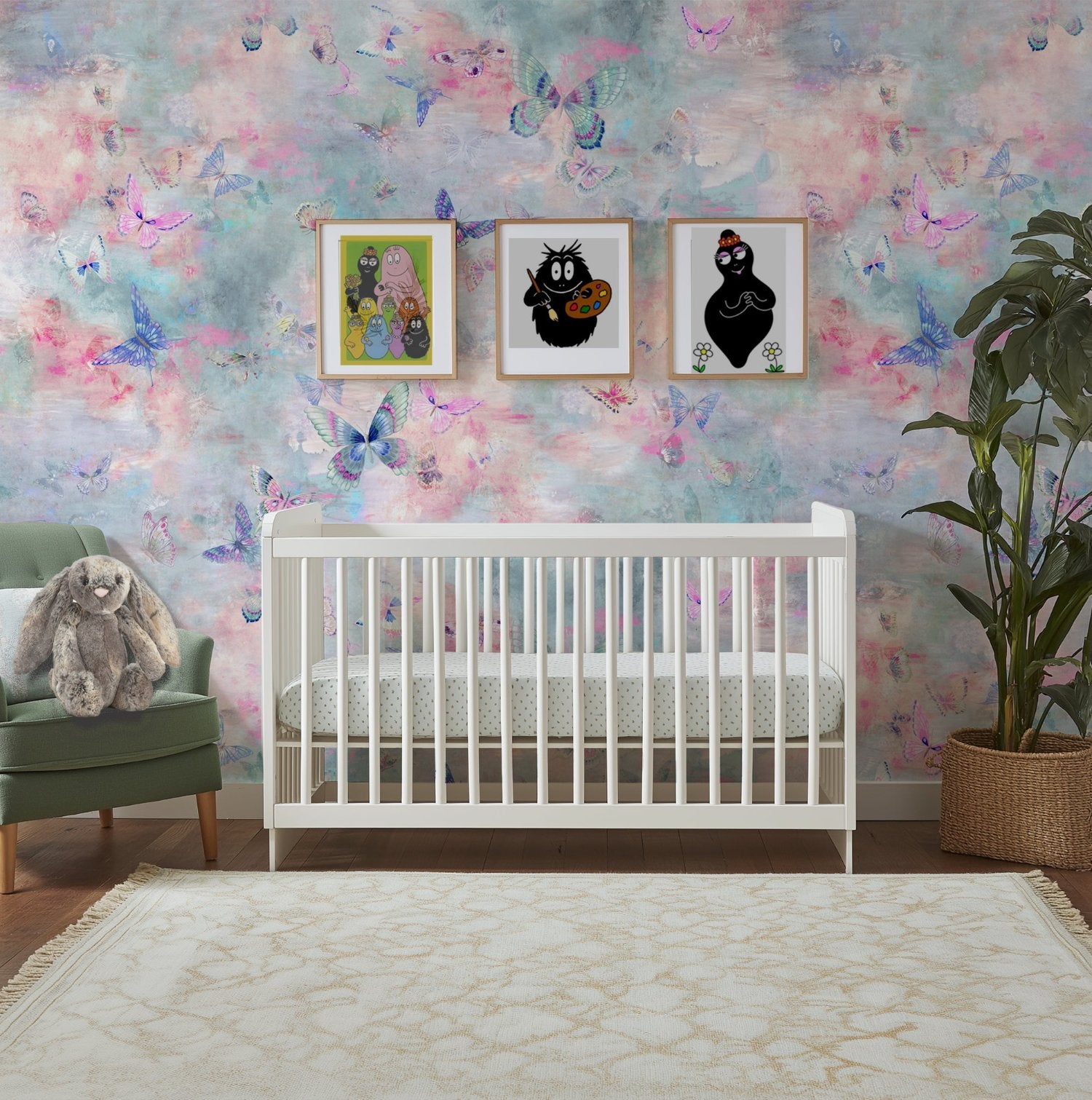 a nursery with a white crib and reverie butterfly wallpaper